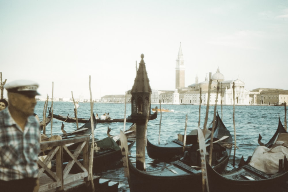 man beside boats in dock