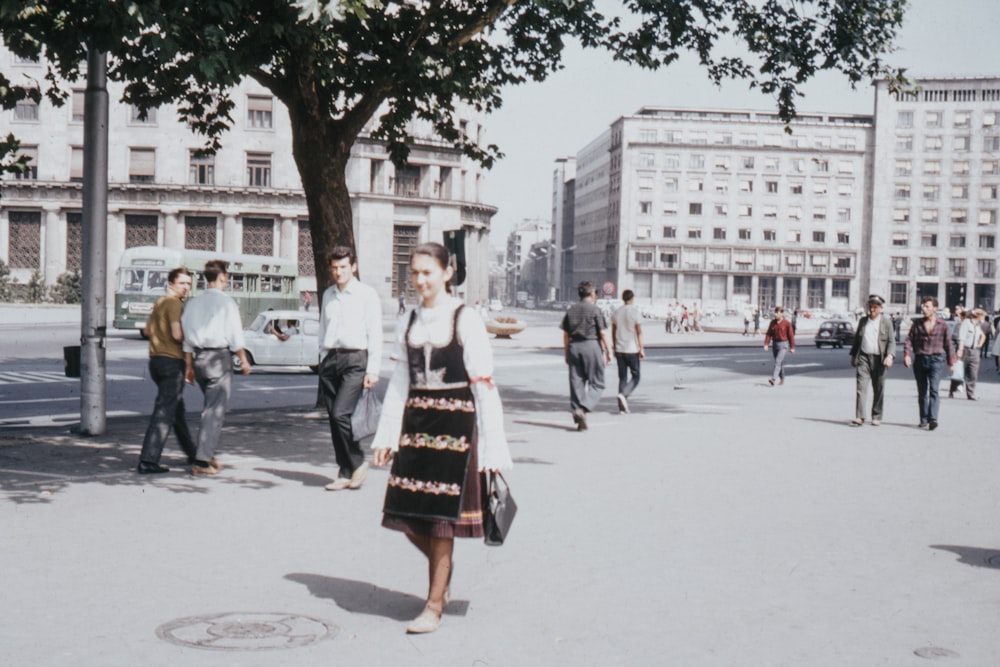 woman walking near buildings