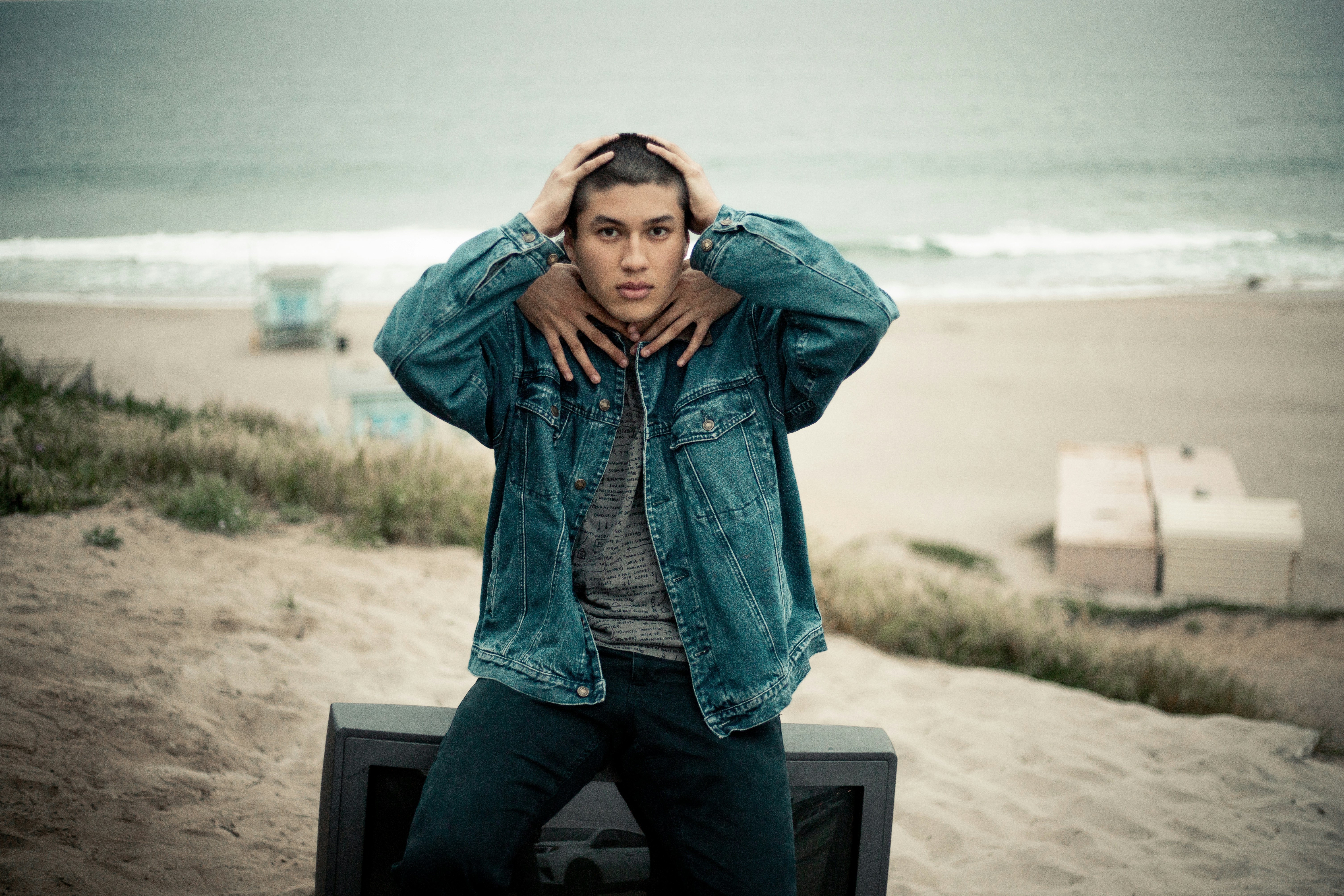 man wearing blue chambray jacket