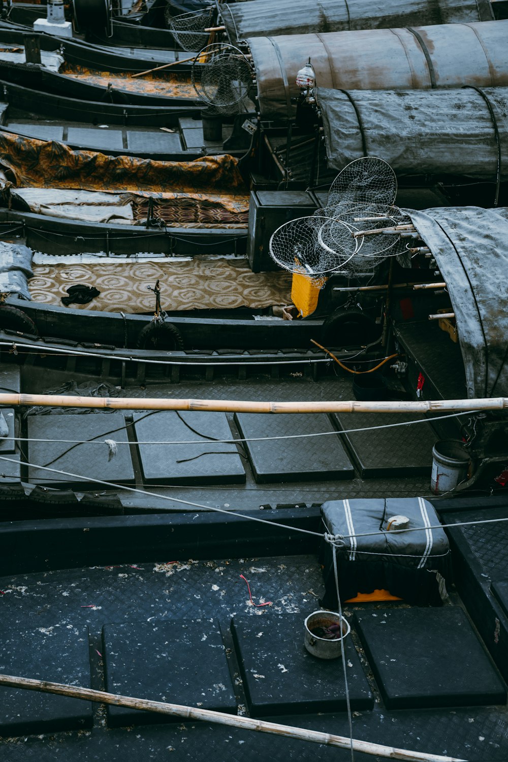 assorted-color boats on beside pier