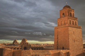 brown castle under gray skies