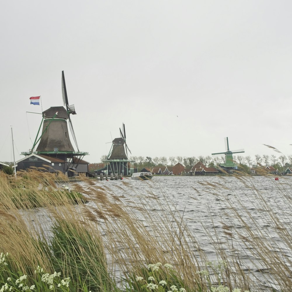view of houses with three windmills