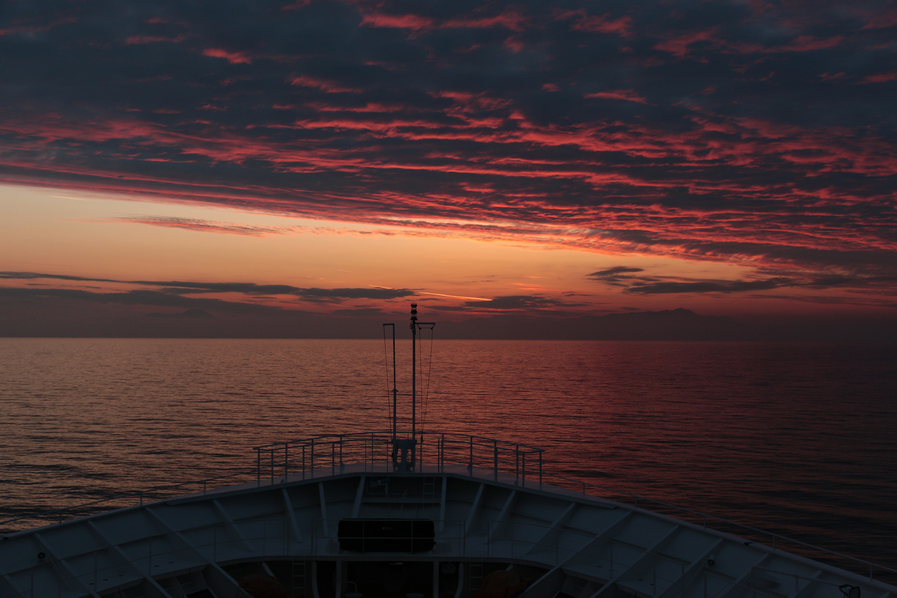 calm sea under clear blue sky during sunset, 
