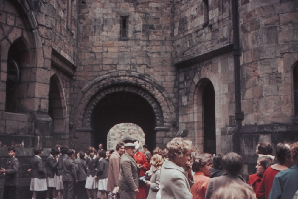 people in front of castle