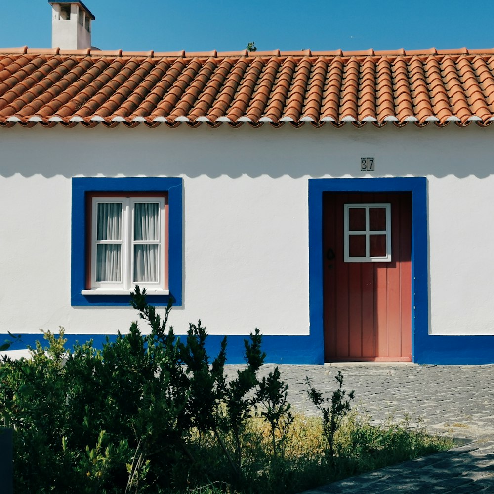 white and blue concrete house