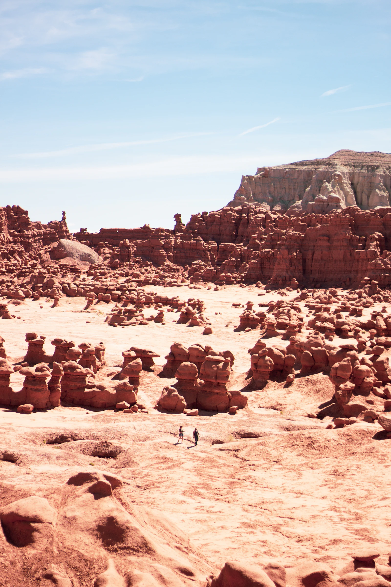Thousands of mushroom-shaped sandstone hoodoos at Goblin Valley State Park in Utah