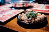 seafood dish on black plate