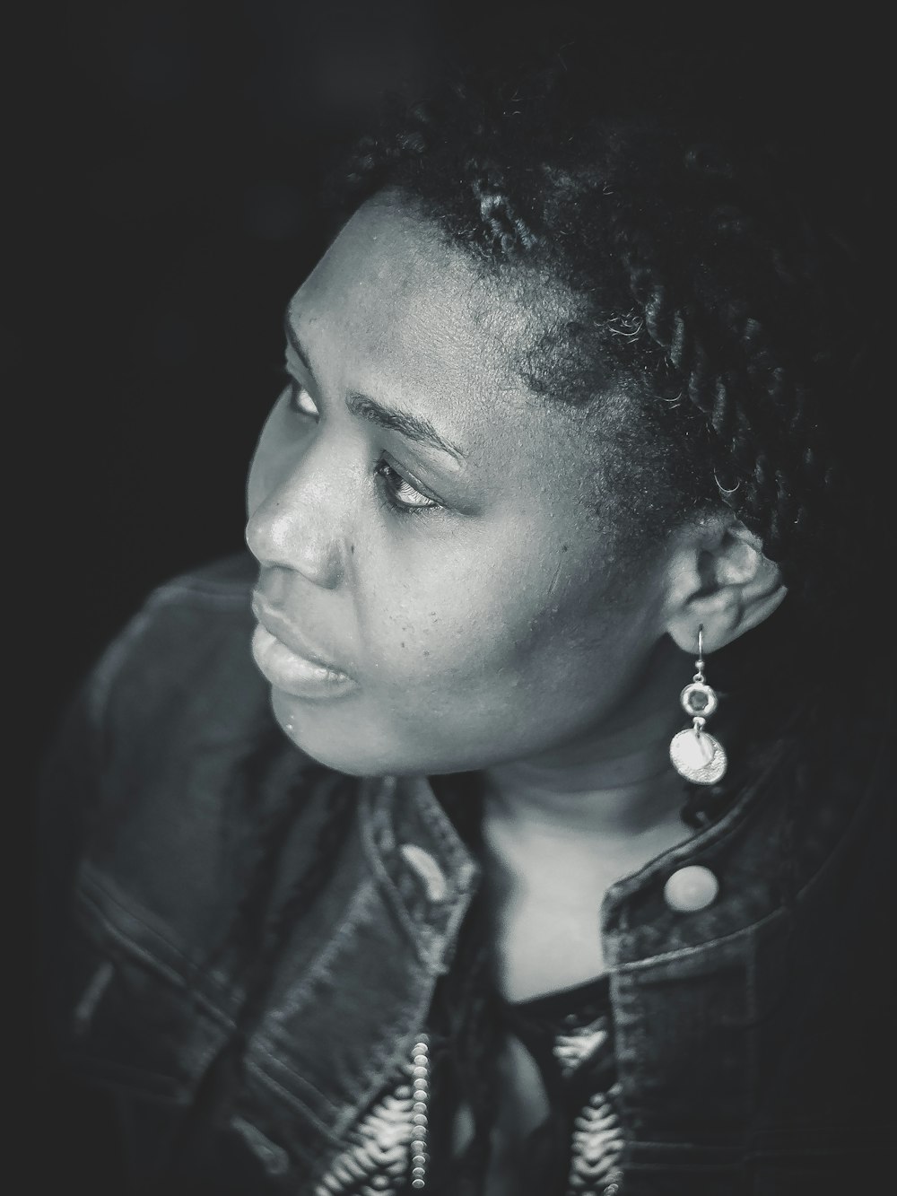 grayscale photo of woman in leather jacket