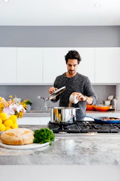 man standing inside kitchen room