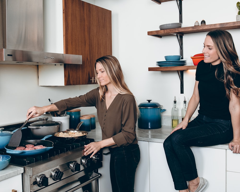 two woman in kitchen