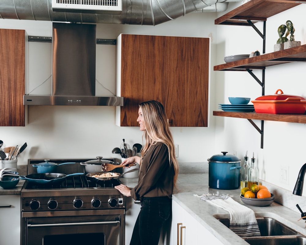 woman holding brown spatula