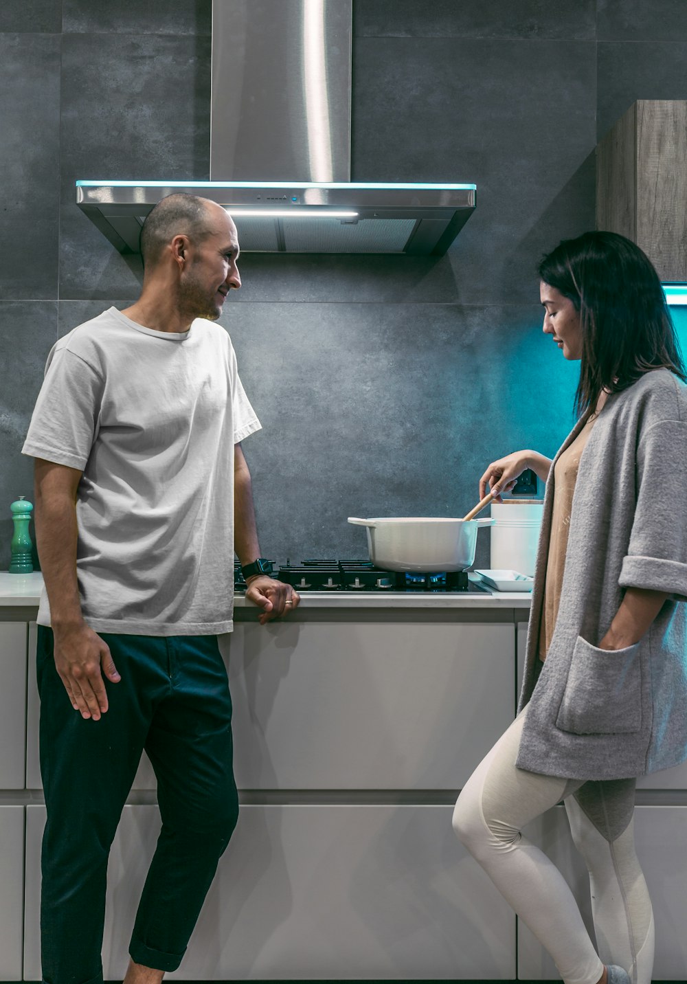 woman and man standing inside kitchen room