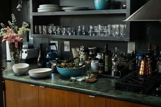 A bright, inviting kitchen countertop with neatly arranged health and household products from sellaroom.