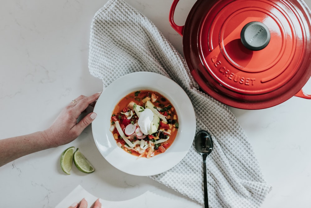 food in white round plate