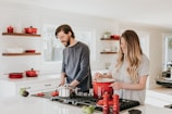 man and woman on kitchen