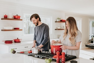 man and woman on kitchen