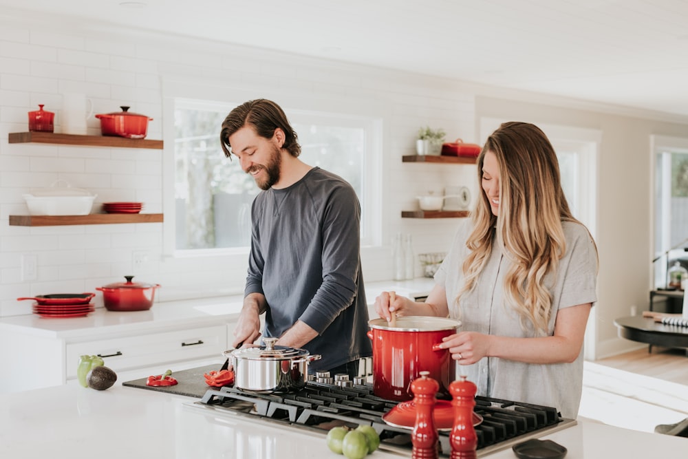 man and woman on kitchen