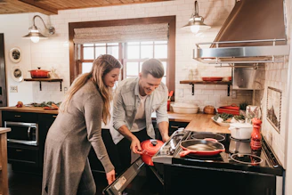 man and woman cooking