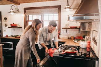 man and woman cooking