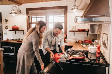 man and woman cooking