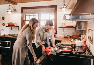 man and woman cooking