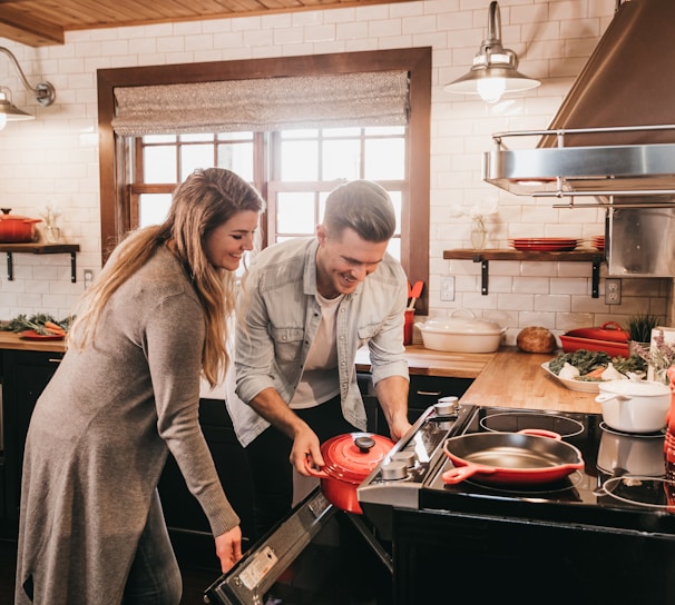 man and woman cooking