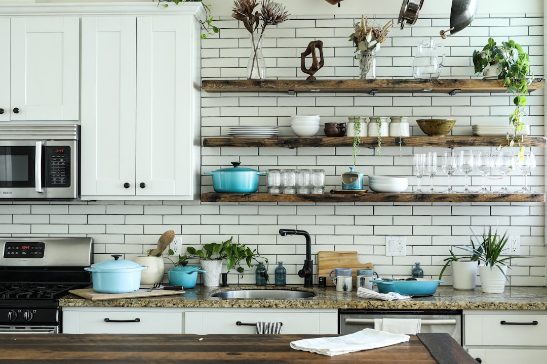 Small kitchen with light cabinets