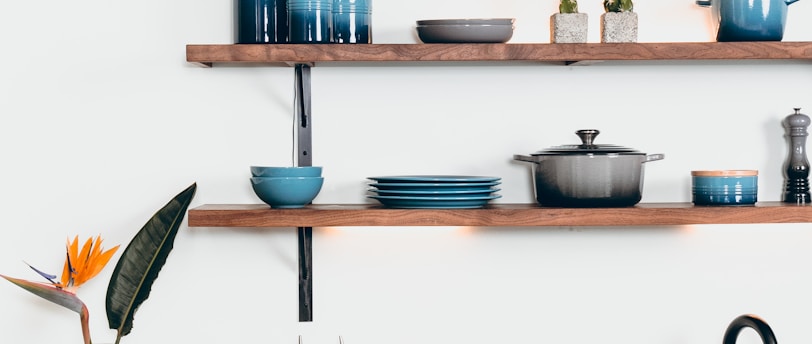 blue ceramic dinnerware on rack