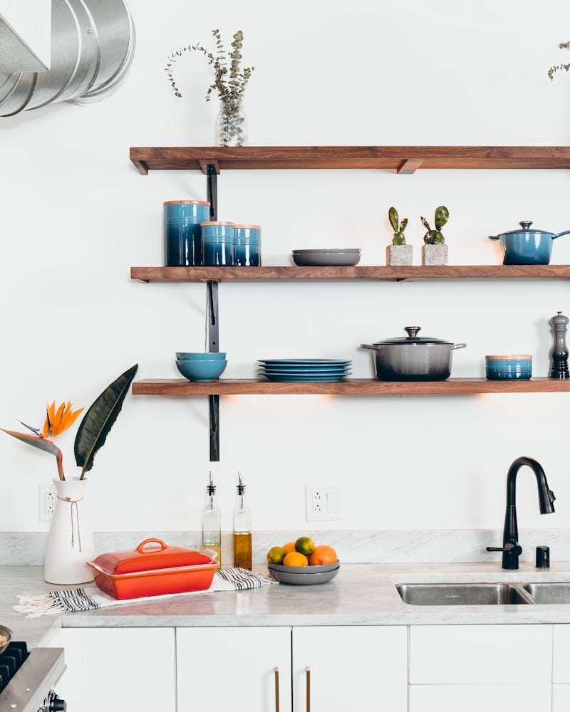 Learn why and how you should add open shelving to your kitchen. Functional decorating means more kitchen storage without a renovation. Free printable guide! DomesticDeadline.com