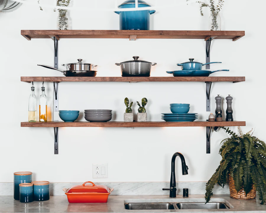 Cookware and kitchenware neatly arranged on shelves