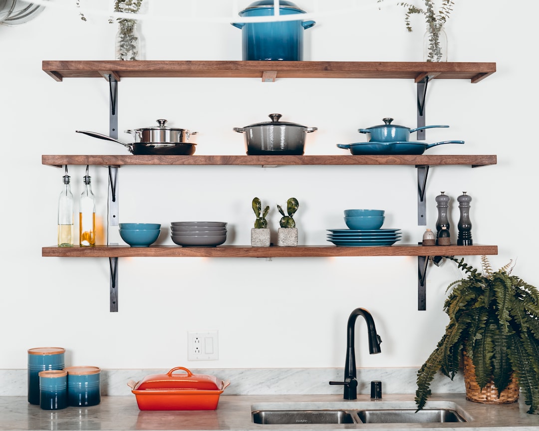 Le creuset pans and pots on shelves