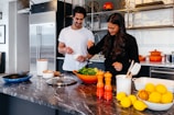 man and woman cooking