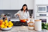 woman cooking inside kitchen room