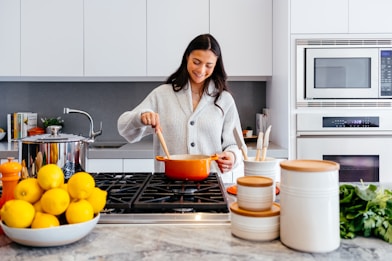 woman cooking inside kitchen room