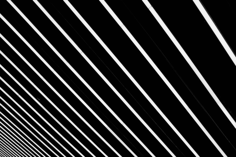 a black and white photo of lines on a wall