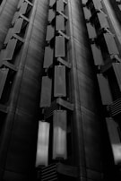 Drone view of a building facade highlighting structural details.