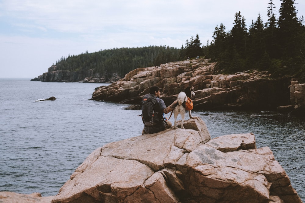 man sitting on rocks