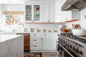 Clean kitchen corner with warm surfaces