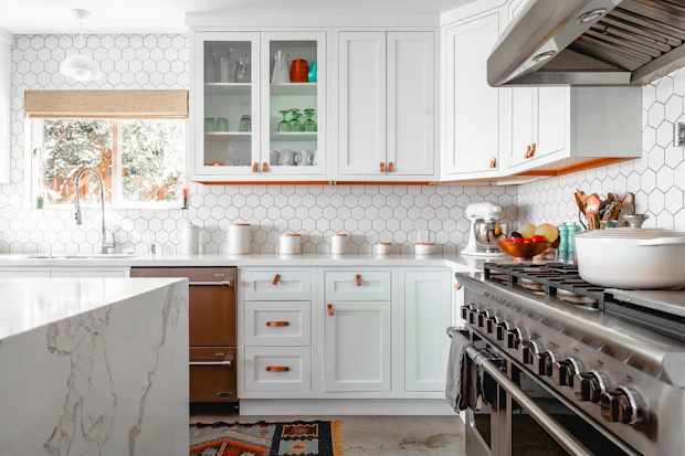 Designer kitchen with pale cabinets