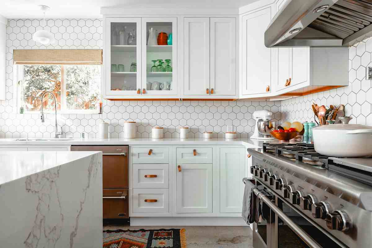 Classic American white shaker kitchen cabinets with brass hardware