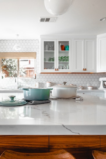 two cooking pots on kitchen a clean, fresh and shiny island