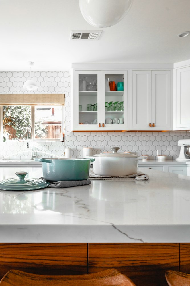 Bright modern kitchen with warm wood cabinets and stone countertops