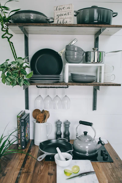 Lodge cast iron skillet and pans on kitchen rack