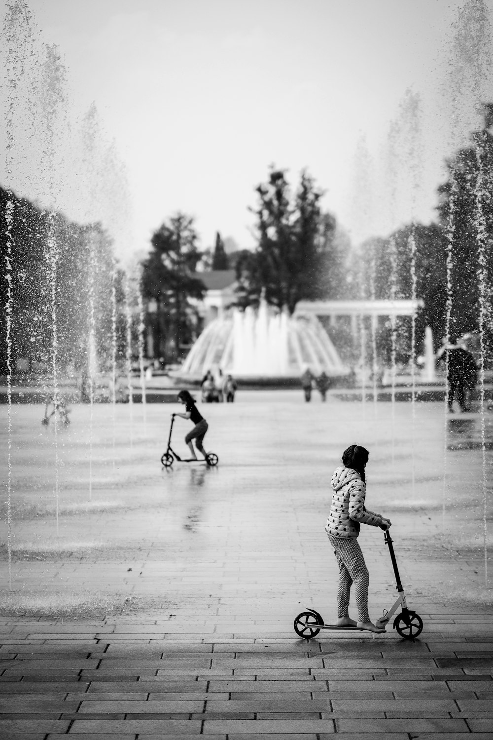 girl riding on kick scooter