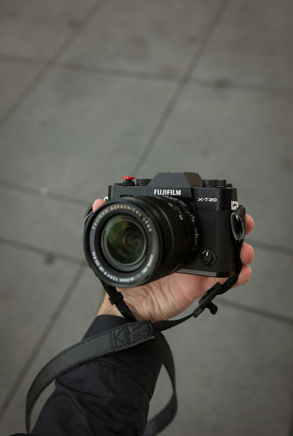 black Fujifilm DSLR camera