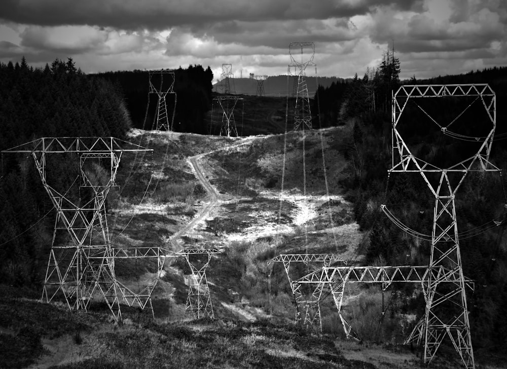 grayscale photography of electric transmitter posts photo
