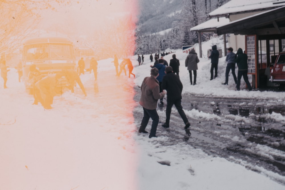 group of people walking on snow