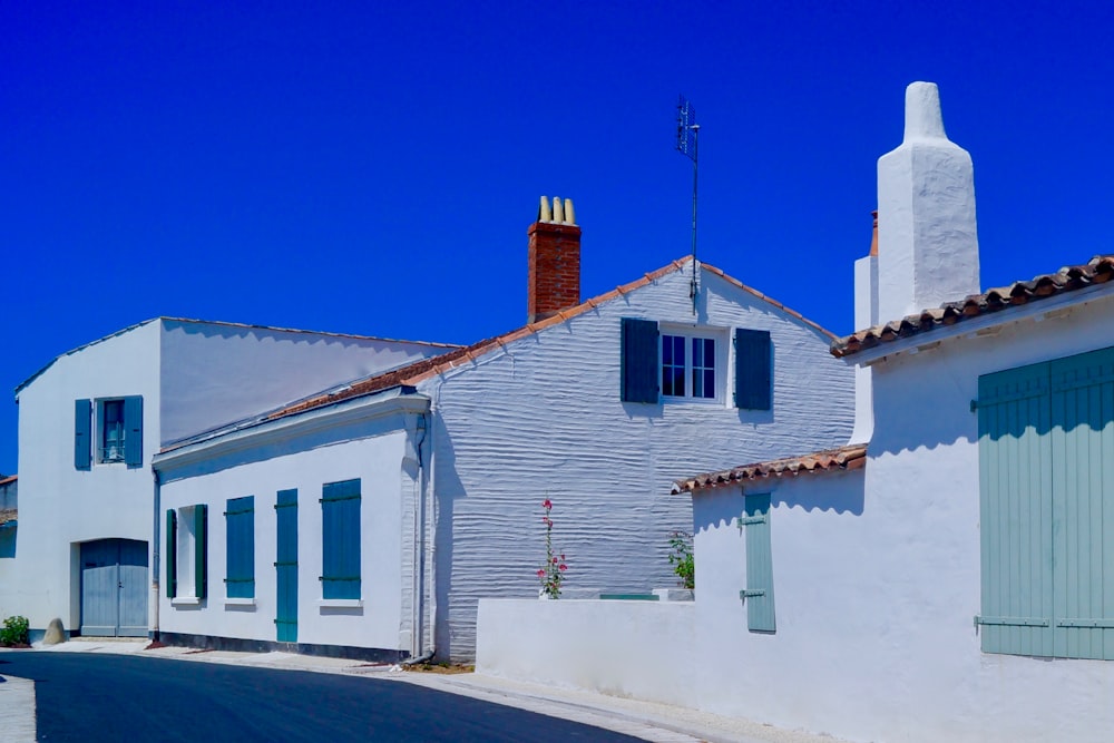 white concrete house with chimney
