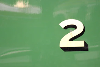 Vertical list showing number 2 in bright blue beside a catchy article headline.