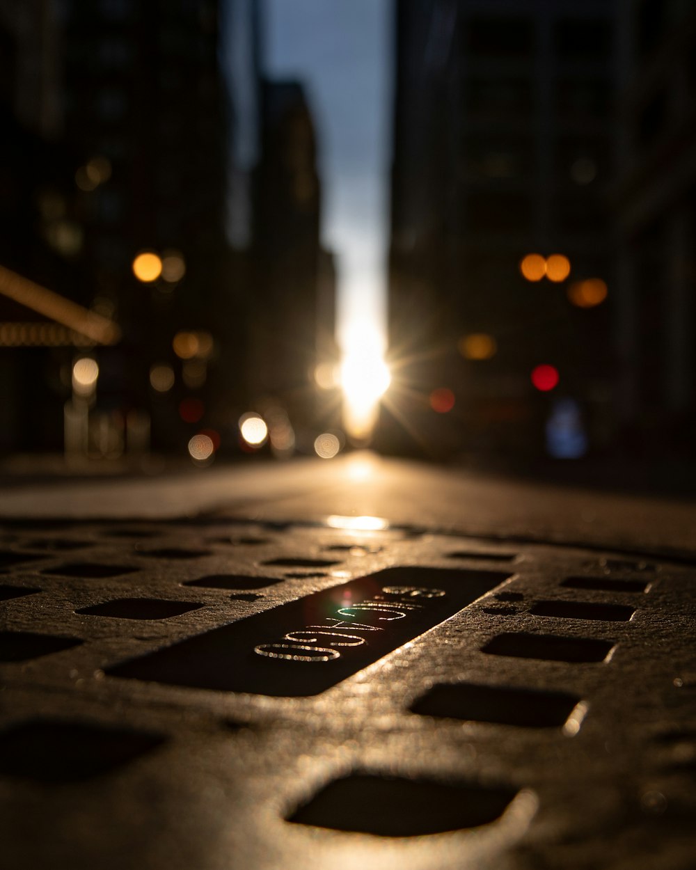 grey man hole with cover at the middle of street